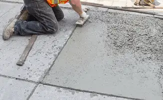 Professional repairing a concrete floor in Columbia, MO